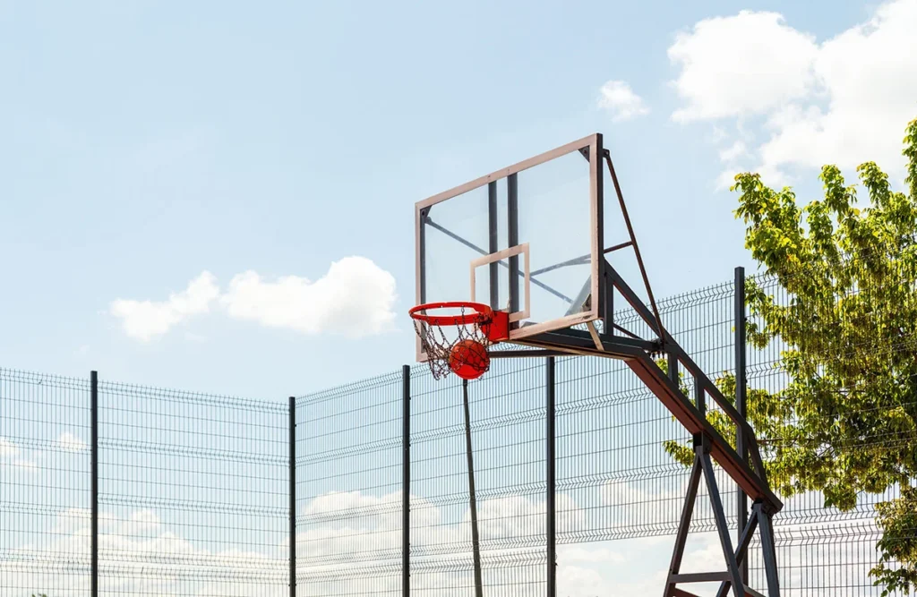 basketball ball falling into the hoop on outdoo