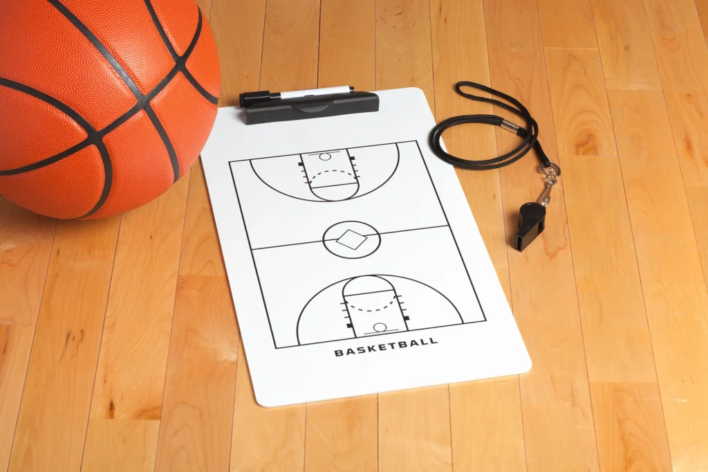 basketball with coach s clipboard