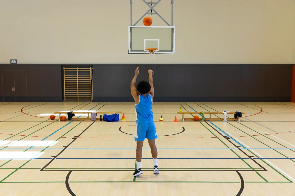 biracial male basketball player wearing blue sport
