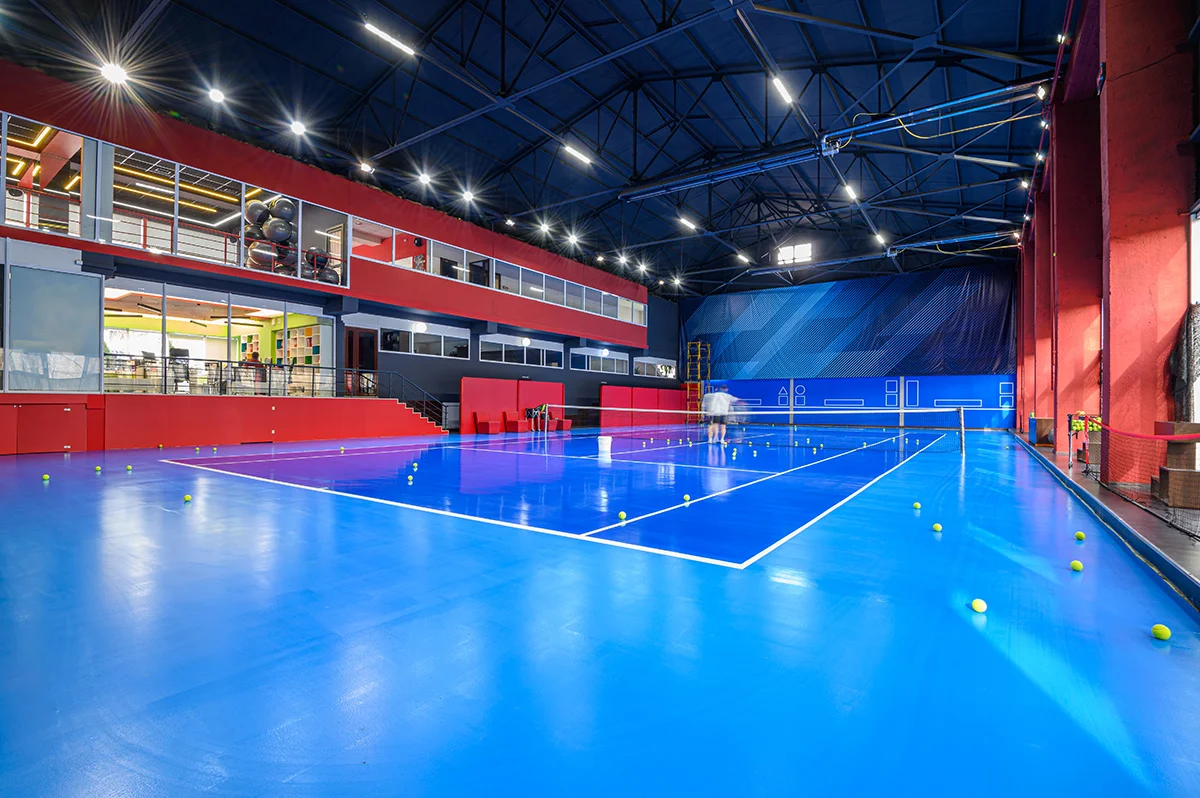 blue colored empty indoor tennis court