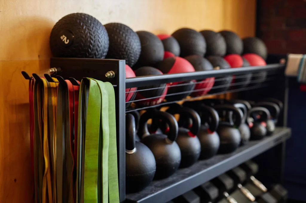 equipment rack in sports club with medballs