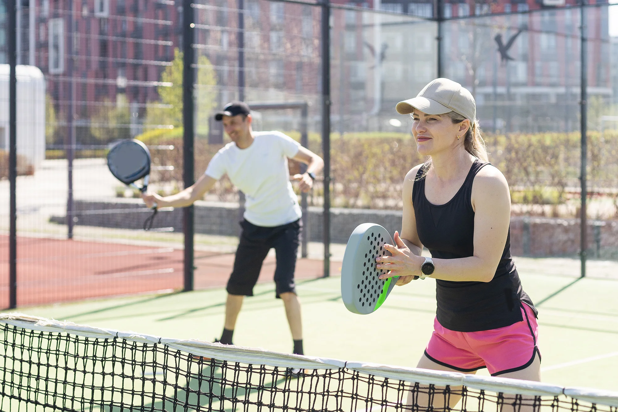 portrait of positive young woman and adult man