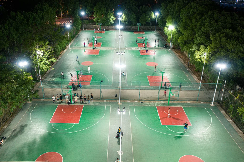 view of a professional basketball court illuminate